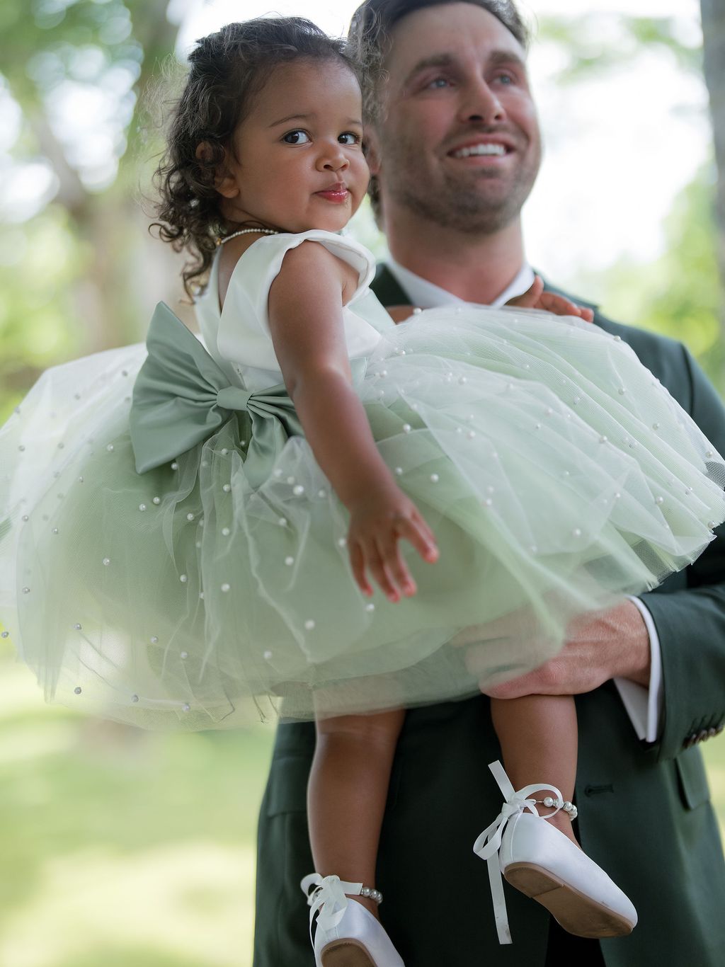 Image may contain Face Head Person Photography Portrait Clothing Footwear Shoe Dress People Formal Wear and Suit