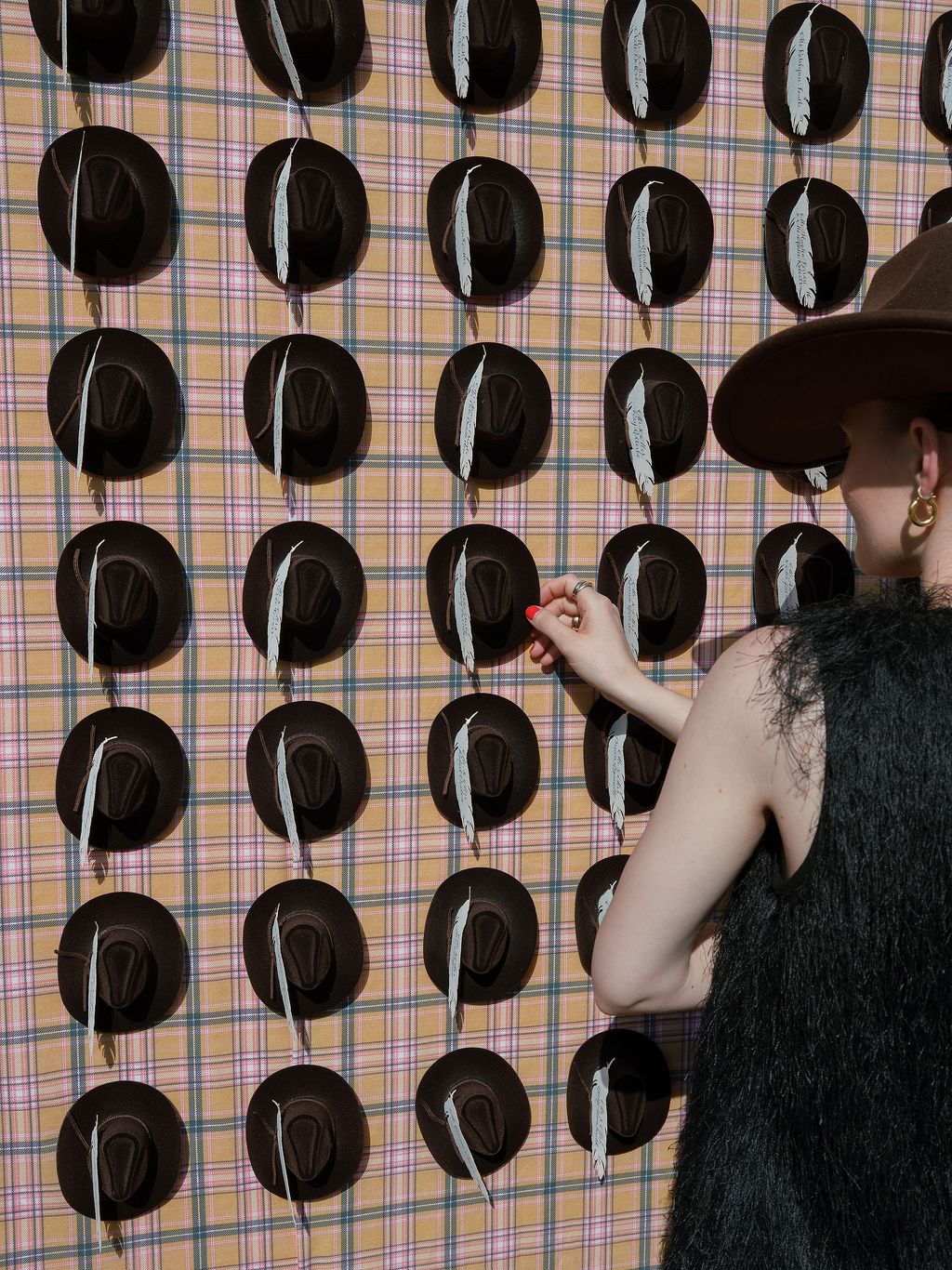 Image may contain Adult Person Clothing Hat Number Symbol Text and Art