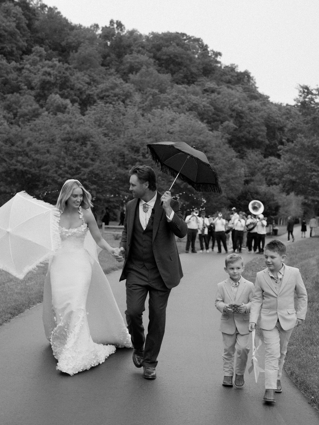 Image may contain Clothing Dress Formal Wear Suit Fashion Gown Wedding Wedding Gown Adult Person Face and Head