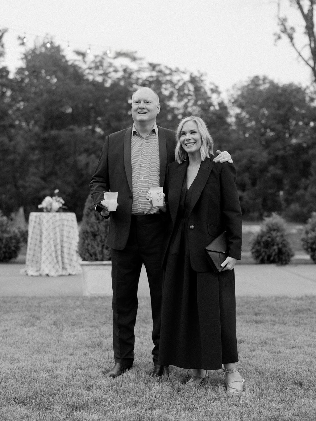 Image may contain Clothing Coat Formal Wear Suit Blazer Jacket Face Head Person Photography Portrait and Grass