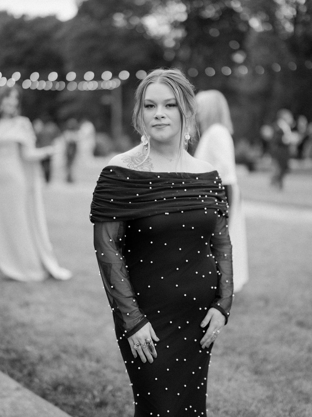 Image may contain Clothing Dress Formal Wear Face Head Person Photography Portrait Adult Evening Dress and Pattern