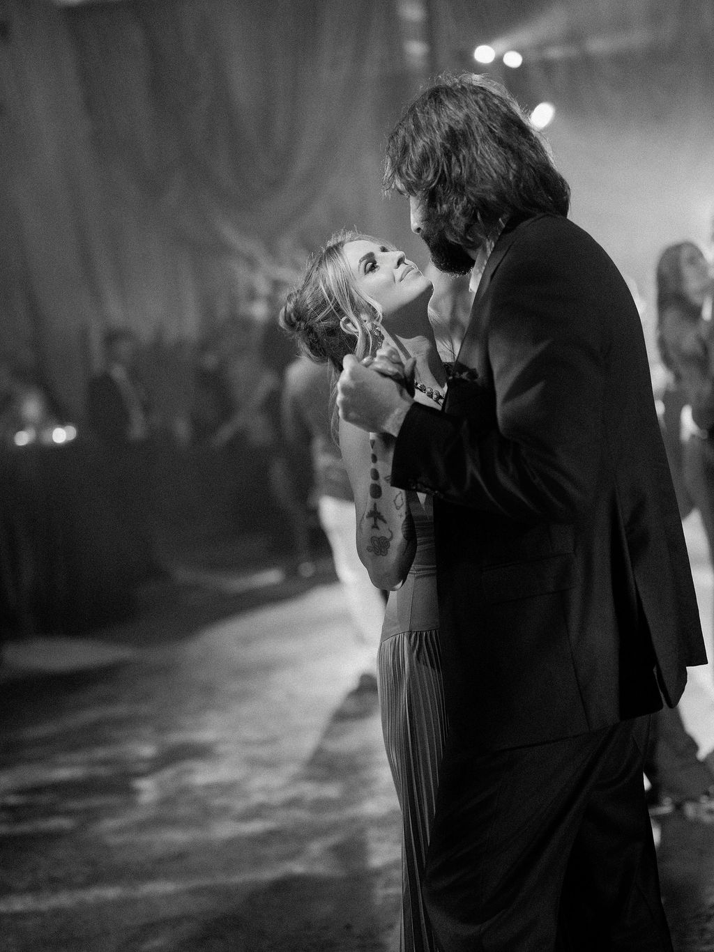 Image may contain Formal Wear Clothing Suit Dress Dancing Leisure Activities Person Adult Fashion Gown and Coat