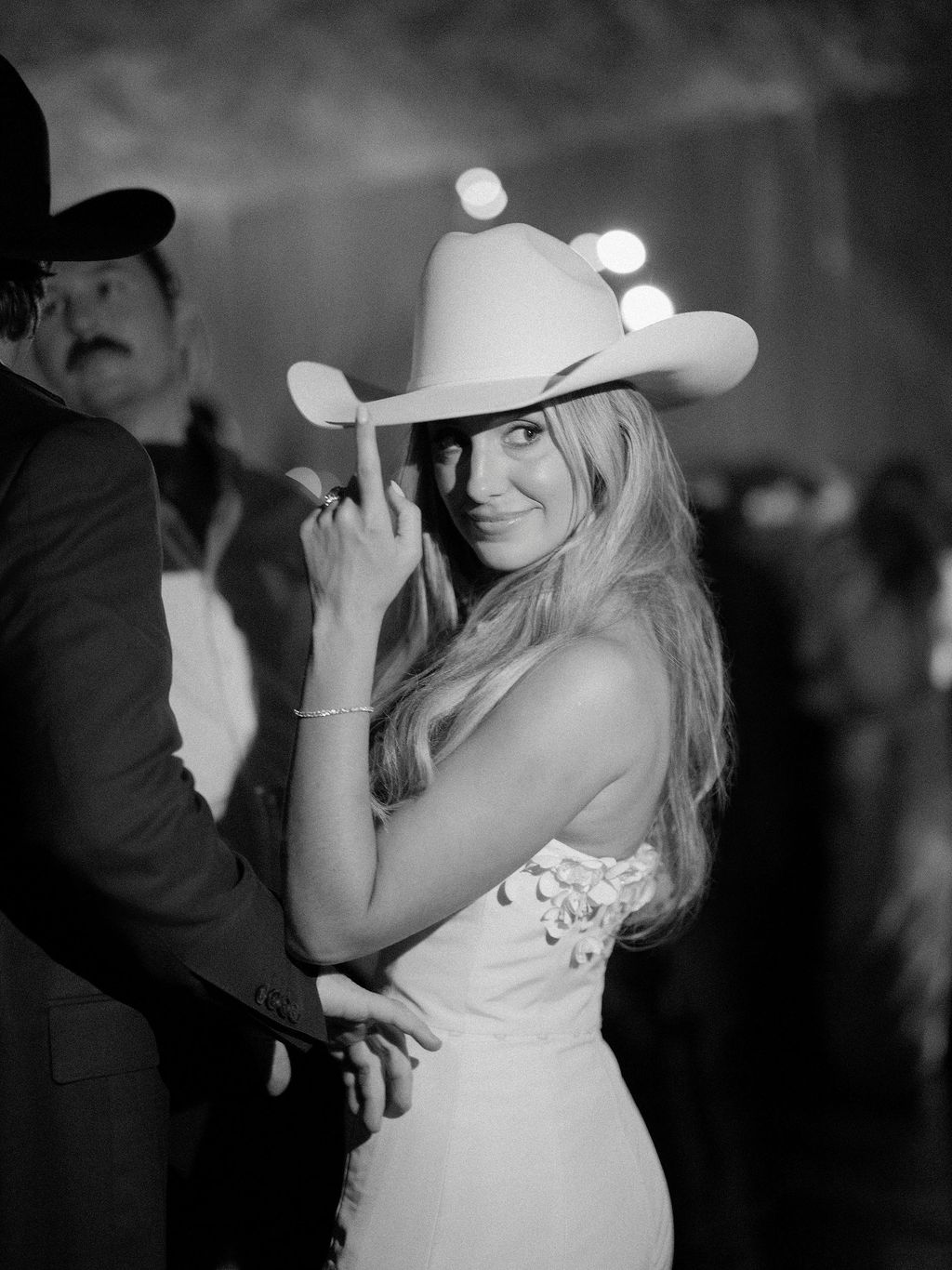 Image may contain Les Claypool Clothing Hat Sun Hat Body Part Finger Hand Person Adult Wedding and Formal Wear