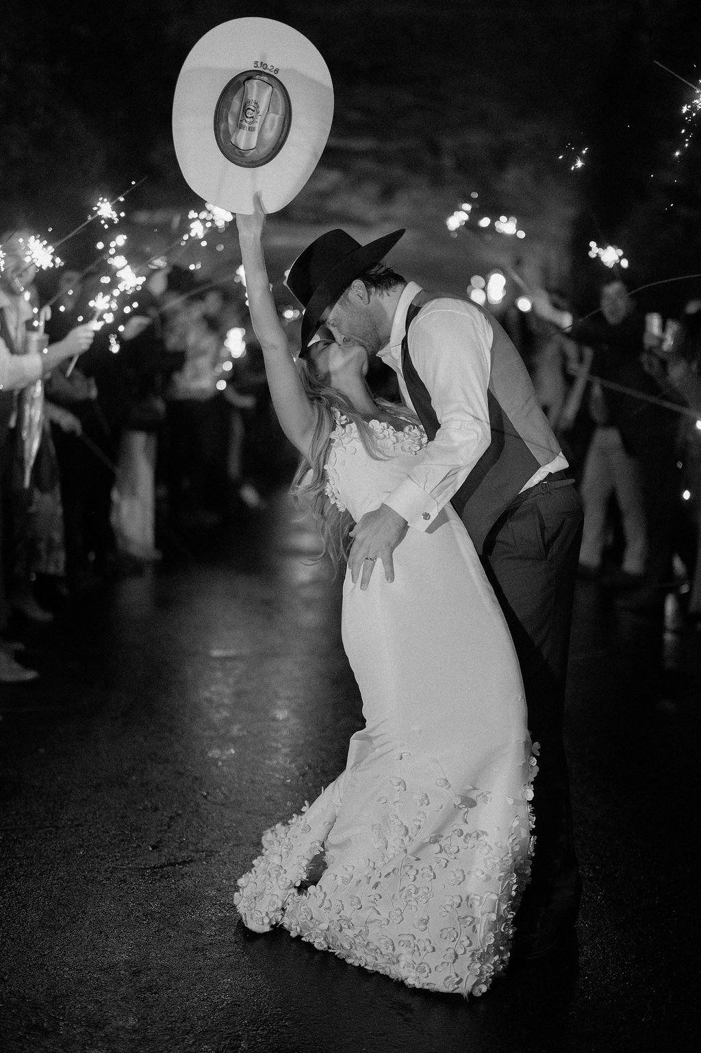Image may contain Clothing Hat Dress Formal Wear Suit Photography Face Head Person Portrait Lighting and Fashion