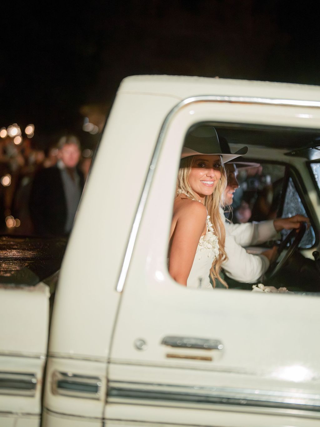 Image may contain Adult Person Wedding Car Transportation Vehicle Clothing Hat Fun and Vacation