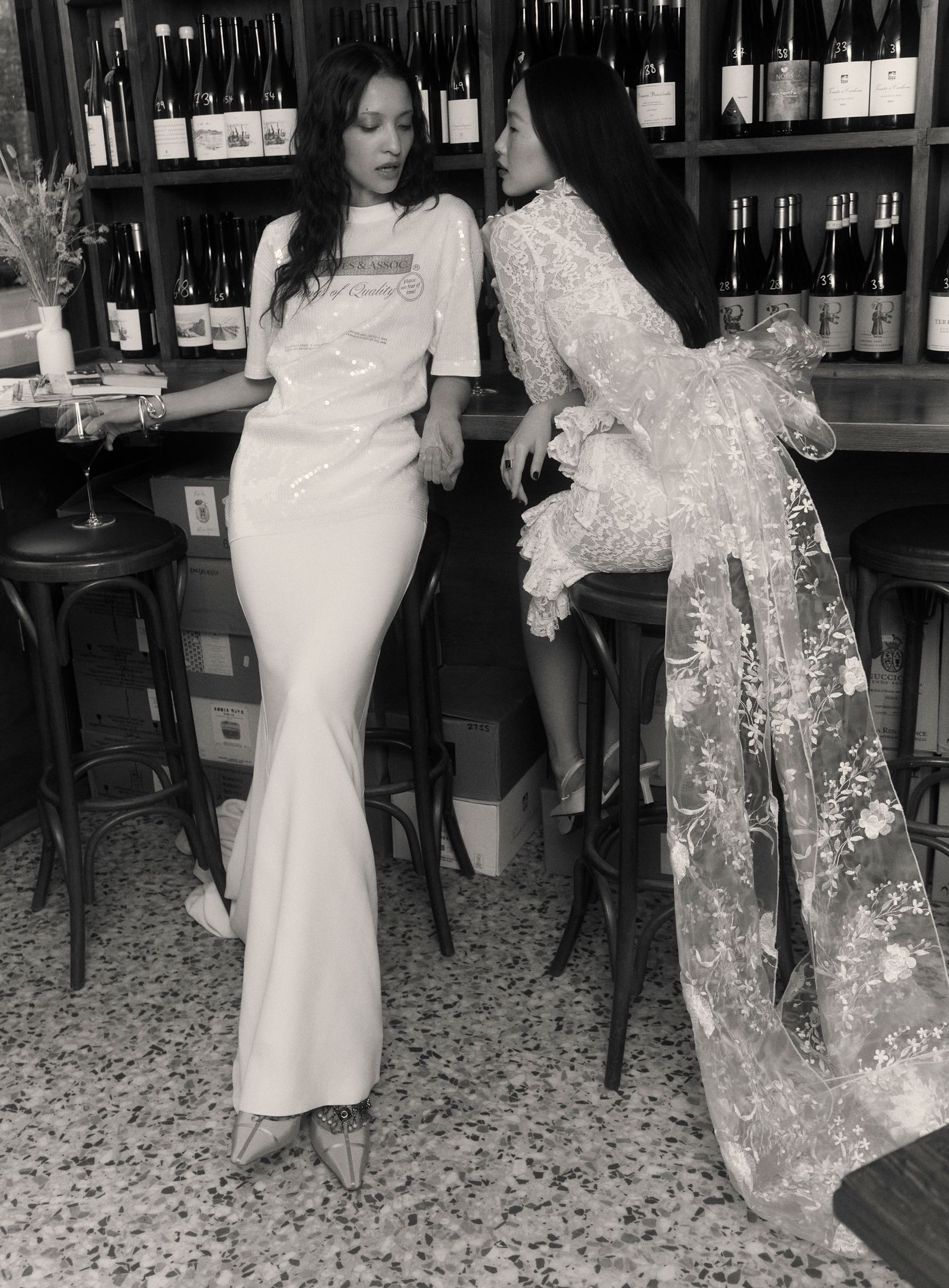 Image may contain Clothing Dress Fashion Formal Wear Gown Adult Person Dining Table Furniture Table and Wedding