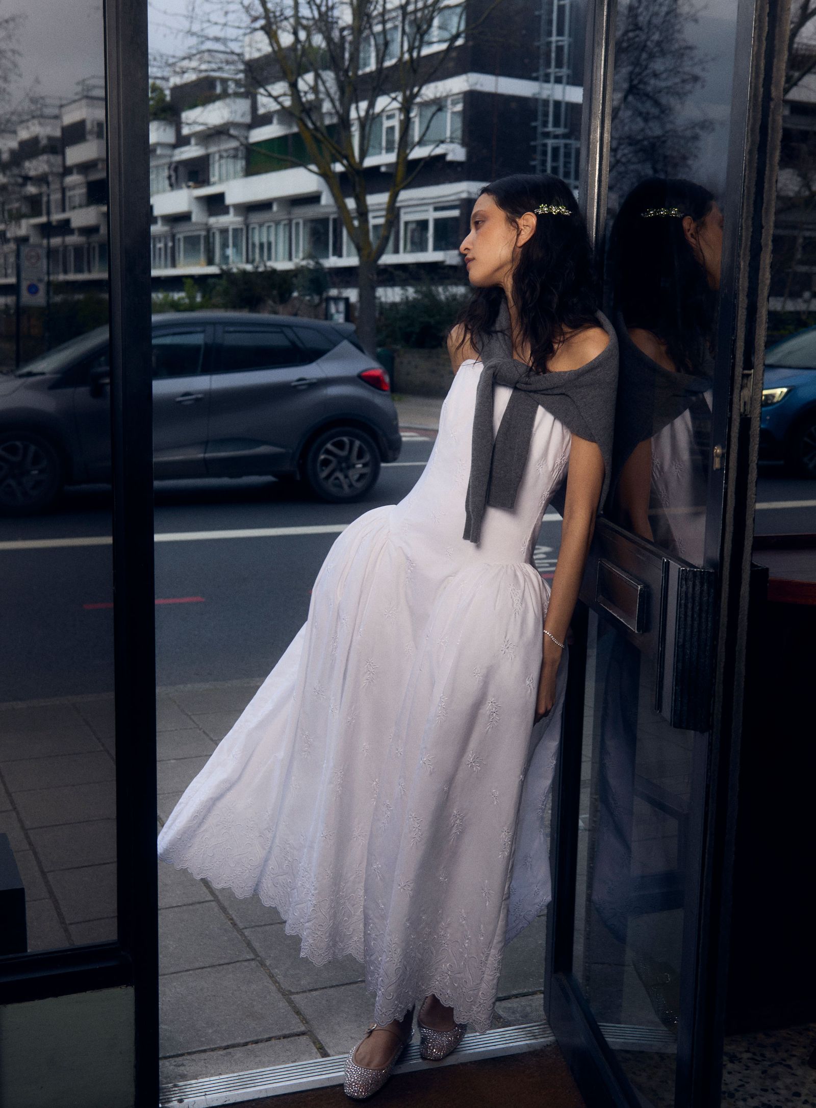 Image may contain Clothing Dress Formal Wear Adult Person Evening Dress Fashion Gown Car and Transportation