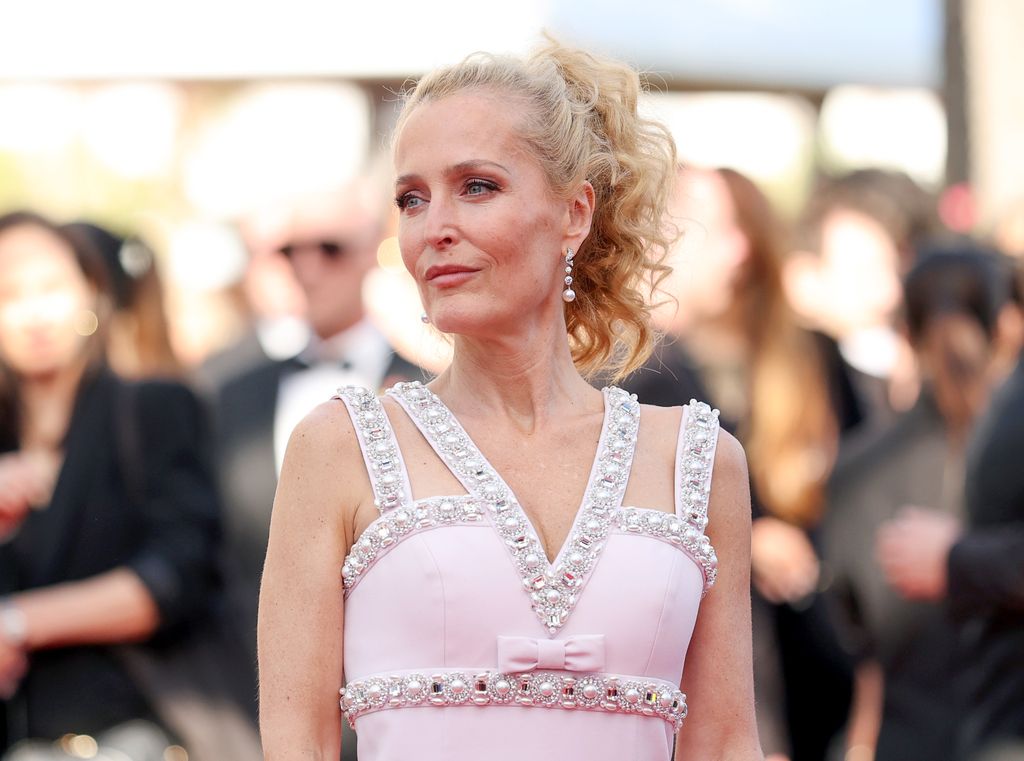 Image may contain Gillian Anderson Person Blonde Hair Clothing Dress Formal Wear Head and Face