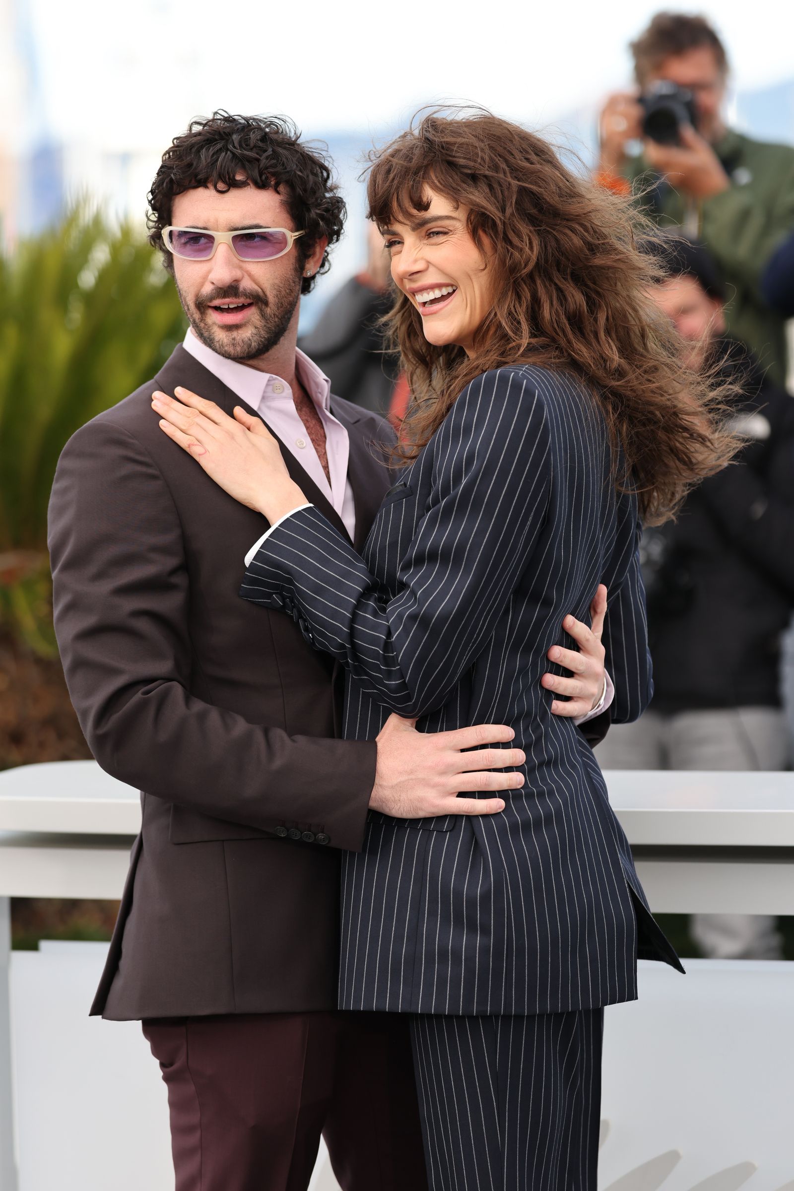 Image may contain Sos Janibekyan Cara Delevingne Face Happy Head Person Smile Clothing Formal Wear Suit and Adult