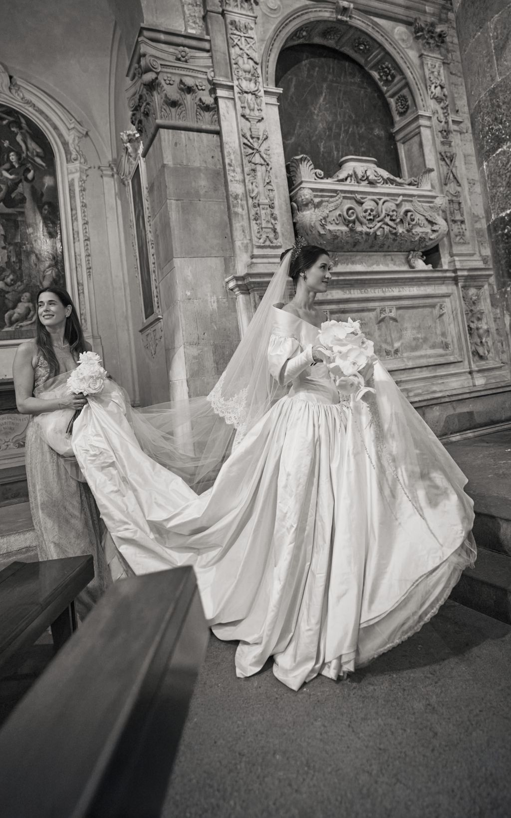 Image may contain Clothing Dress Fashion Formal Wear Gown Wedding Wedding Gown Adult Person Altar and Architecture
