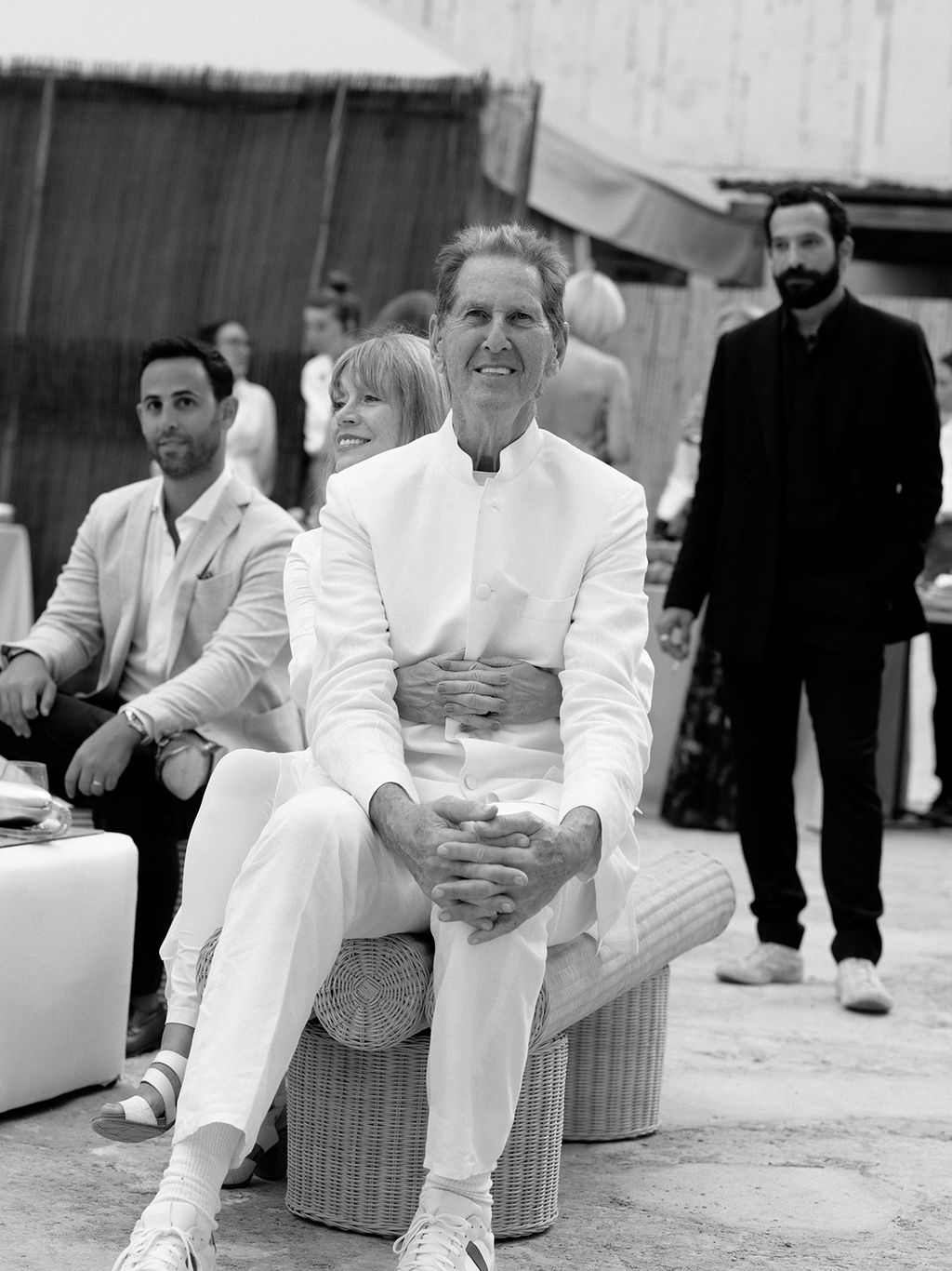 Image may contain Clothing Coat Formal Wear Suit Footwear Shoe Adult Person People Face Head and Photography