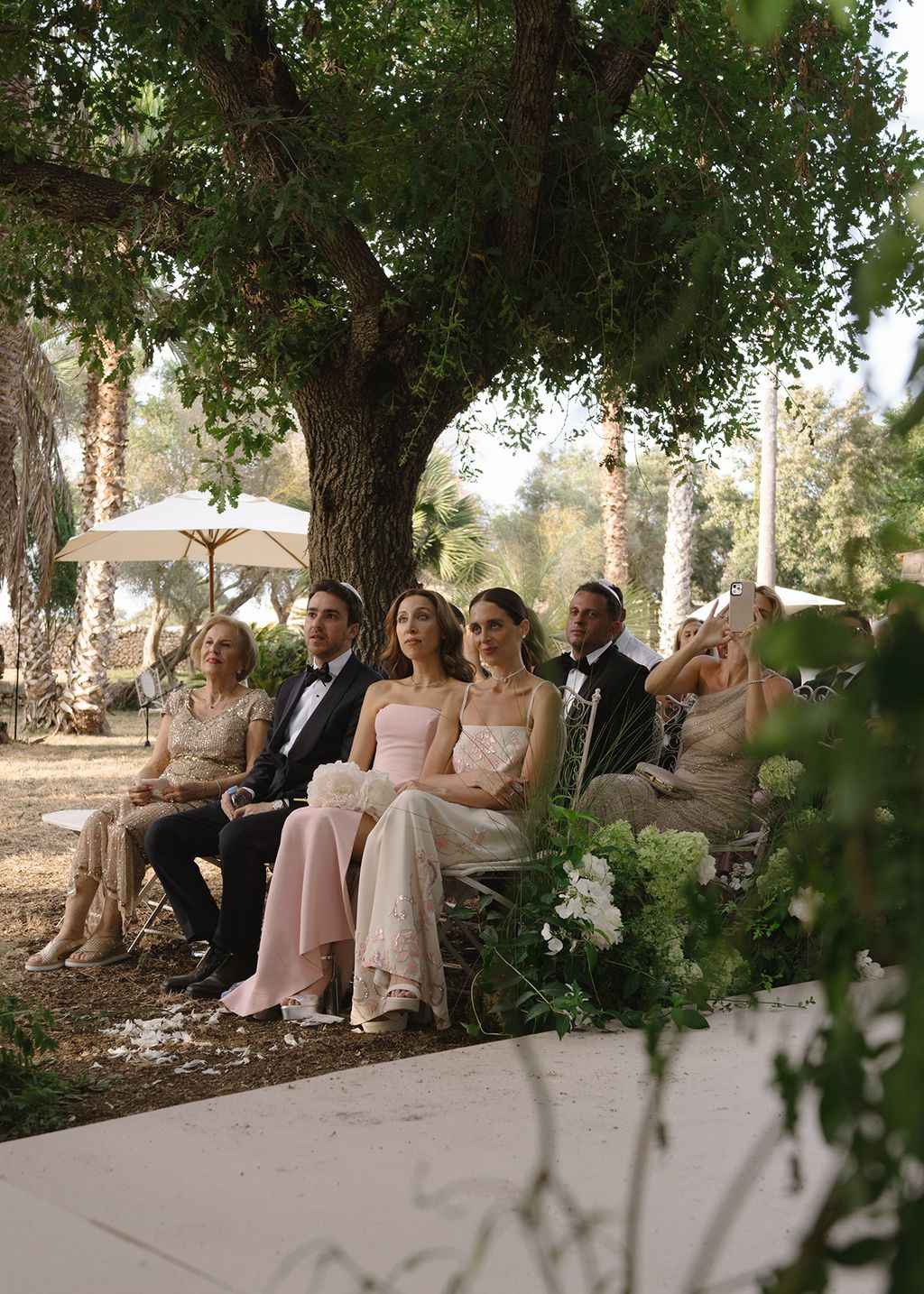 Image may contain Plant Tree Potted Plant Clothing Formal Wear Suit Dress Fashion Gown Wedding and Wedding Gown