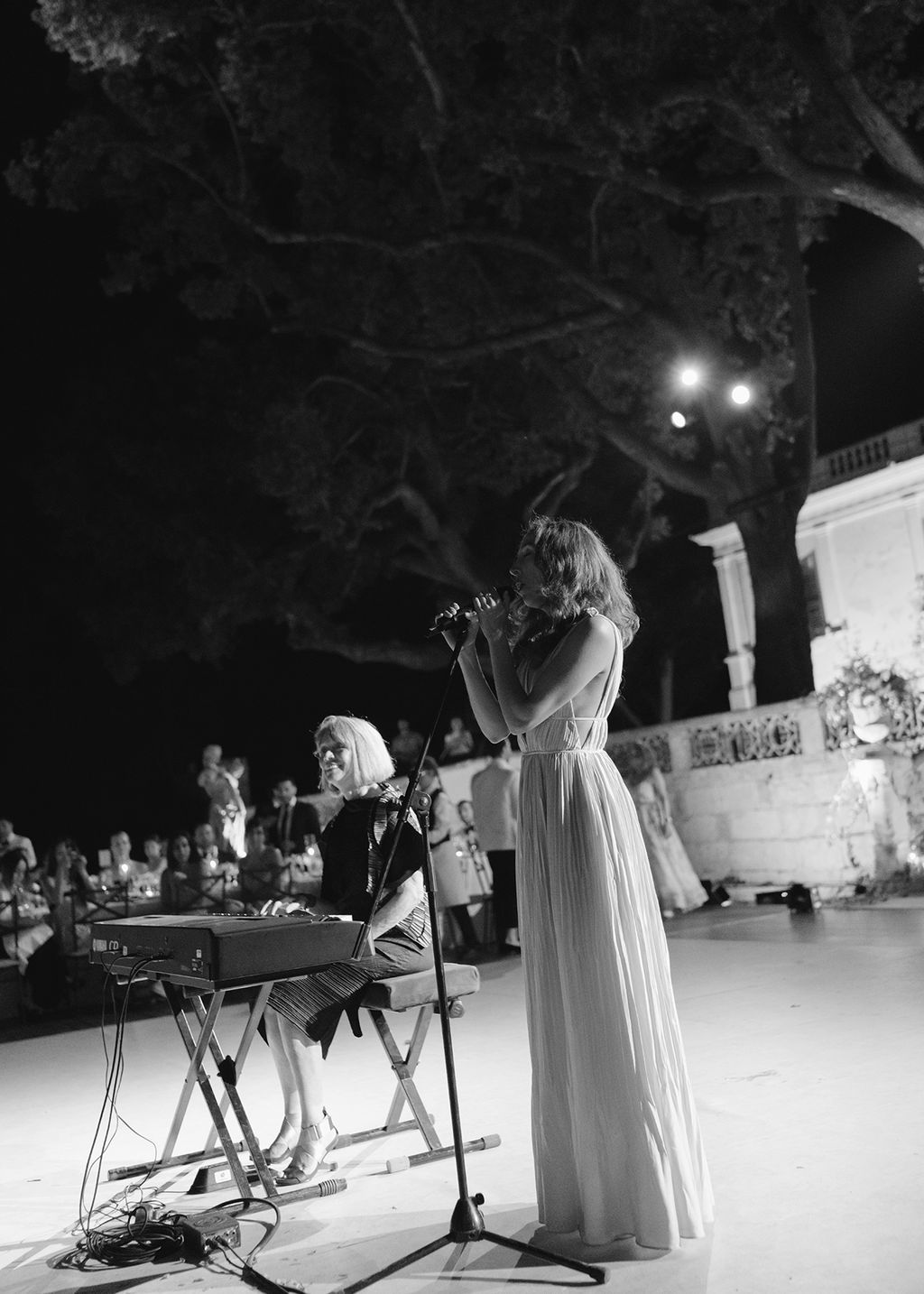 Image may contain Lighting Adult Person Wedding Leisure Activities Music Musical Instrument Musician and Performer