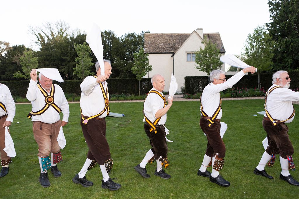 Image may contain People Person Grass Plant Adult Clothing Footwear Shoe Costume Lawn Sword and Weapon