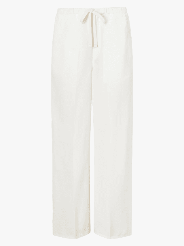 Image may contain Clothing Pants Home Decor Linen and Shirt