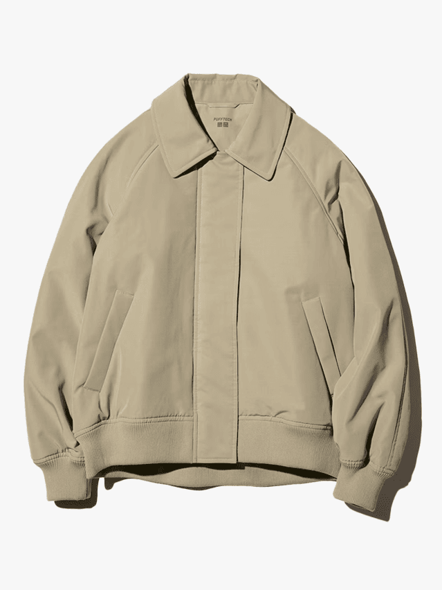 Image may contain Clothing Coat Jacket Khaki Knitwear Sweater and Fleece